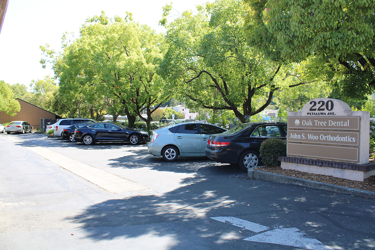 Parking lot view of Oak Tree Dental.